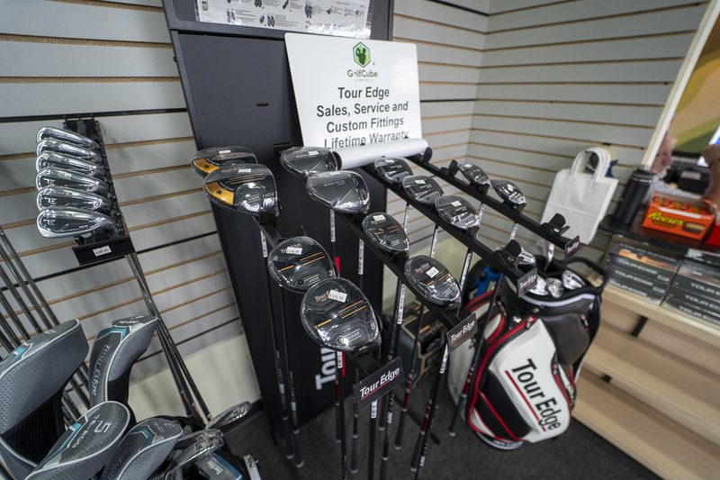 Tour Edge club display with sales and fittings